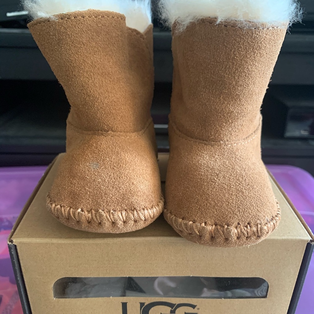 Gently worn pair of UGGs I Caden booties 0/1